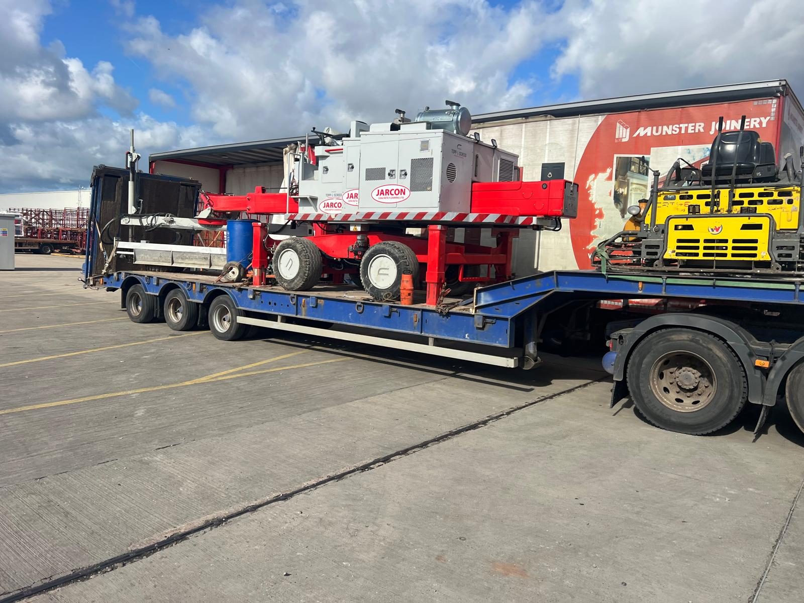 Screed and floating plant loaded on a low loader